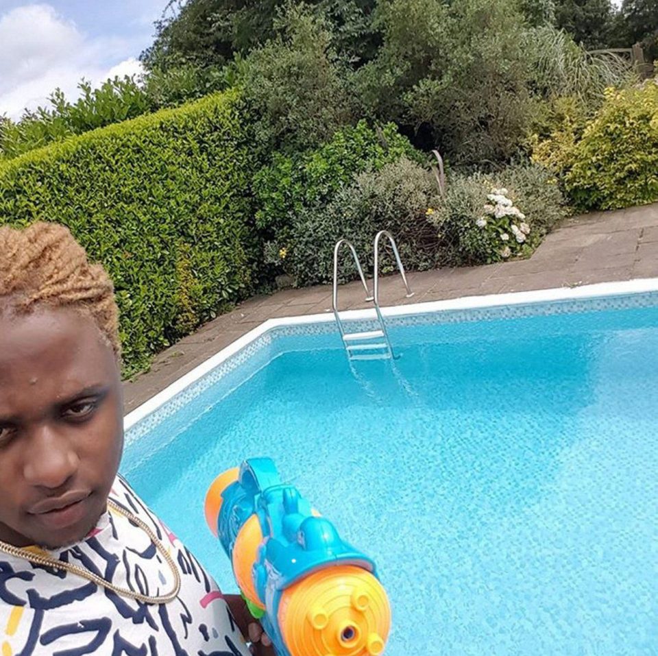  Party organiser Braintear Spookie, aka Jason White, poses with a water pistol hours before the party turned into a deadly shooting