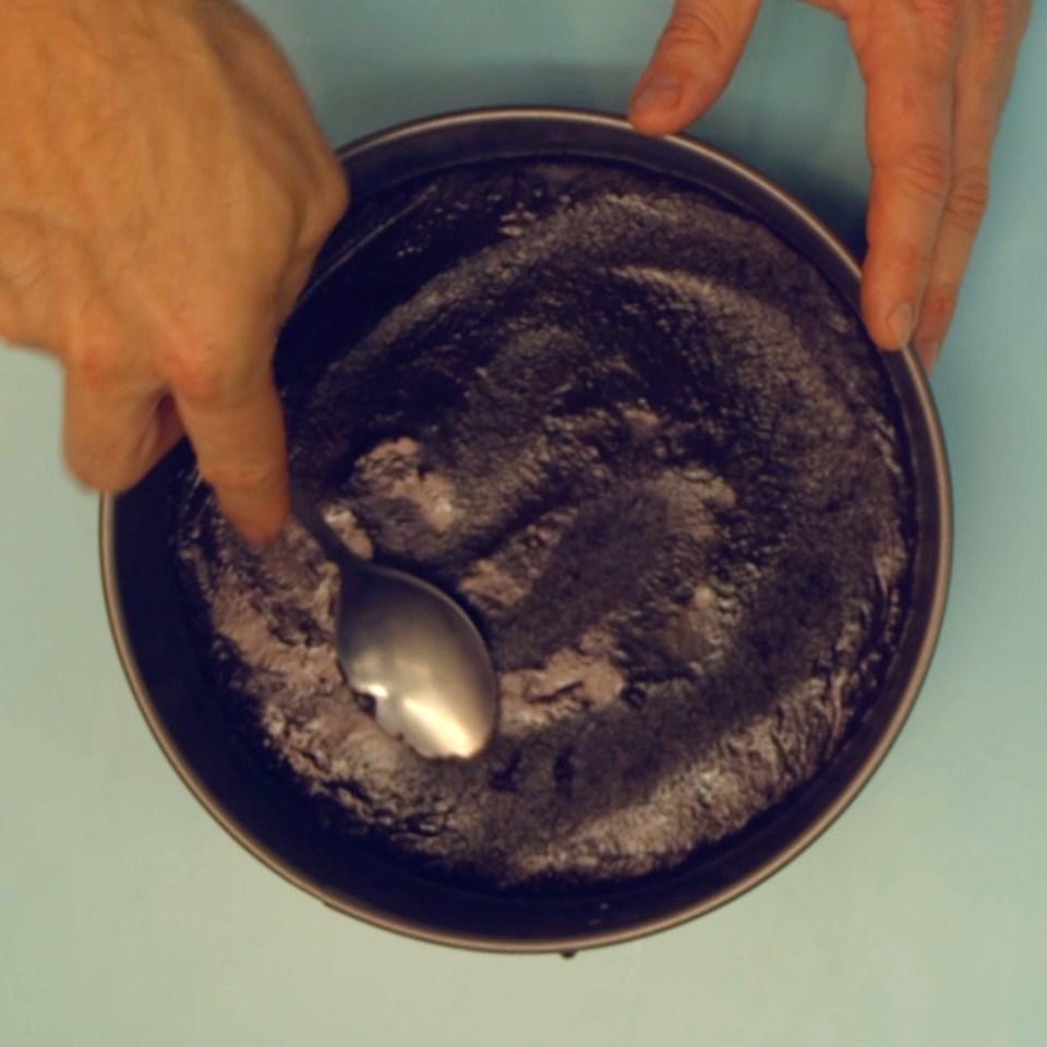  Empty out onto a baking parchment lined tin and smooth out