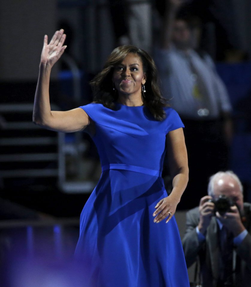  Dressed in a designer blue dress, she waved to the crowds after her barnstorming speech