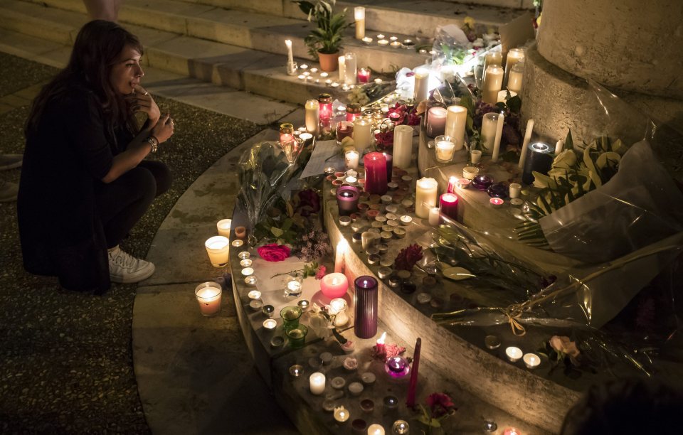  People gather to pay their respects at the makeshift memorial in the Normandy town which was hit by the latest terror attack