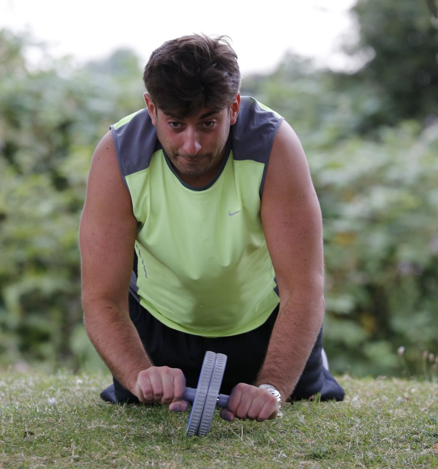  James 'Arg' Argent focuses on his abs during a workout in the park