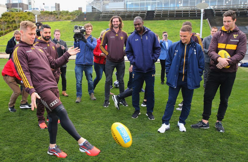  Sam Mitchell shows how to pull off a perfect Aussie Rules Football kick