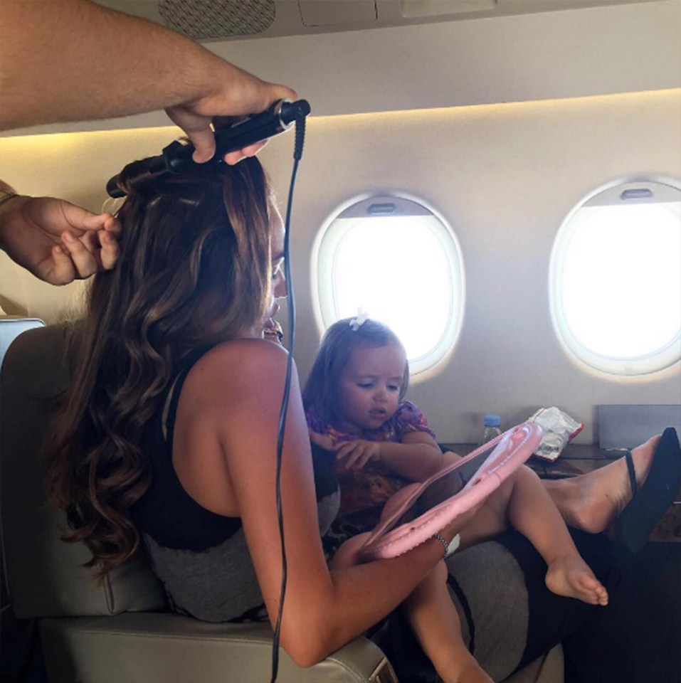 Tamara shared a snap of her having her hair done on her jet as she kept Sophia occupied at the same time