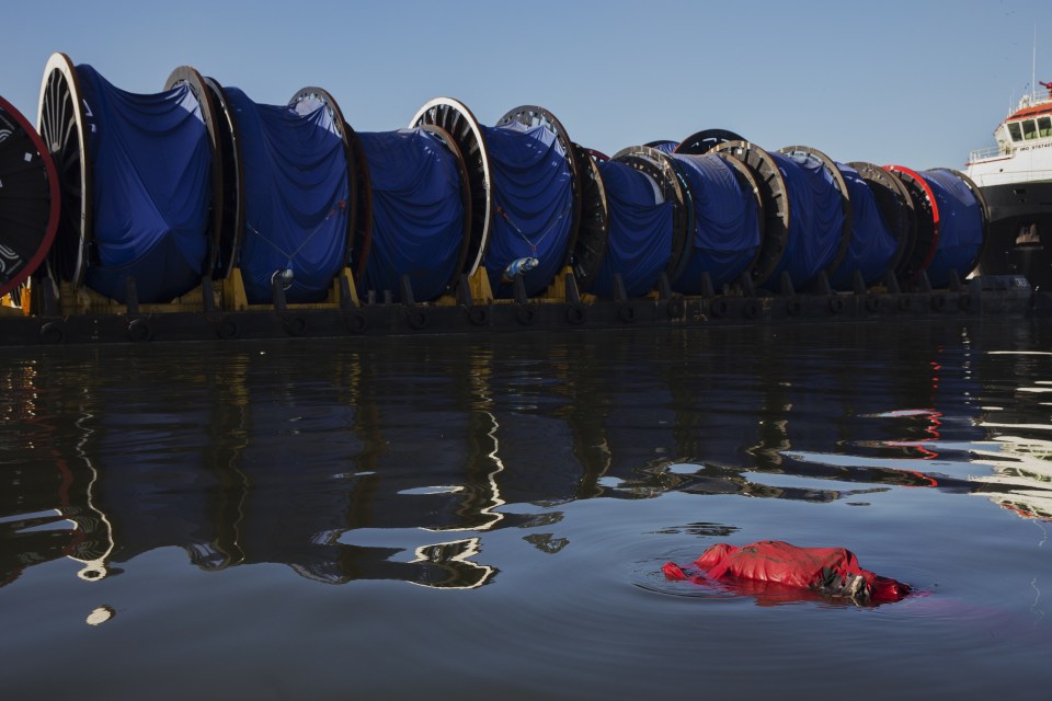  A body floats in the waters of Guanabara bay, a sailing venue for the 2016 Olympics, in Rio de Janeiro.