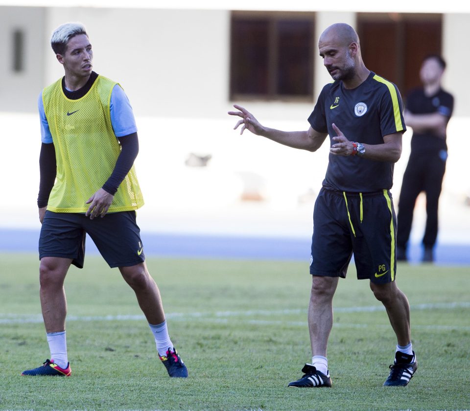 Pep Guardiola (r) has claimed his French midfielder came back to pre-season overweight