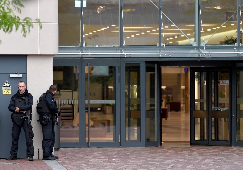  Armed police were seen peering around the entrance of the mall as daylight faded in the German city