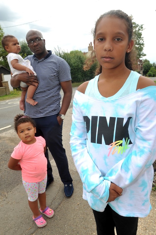  Atiya Fox, 9, at her home in Haddenham, Bucks, with her family after being told she was 'too tall' to be qualified for a kids' meal