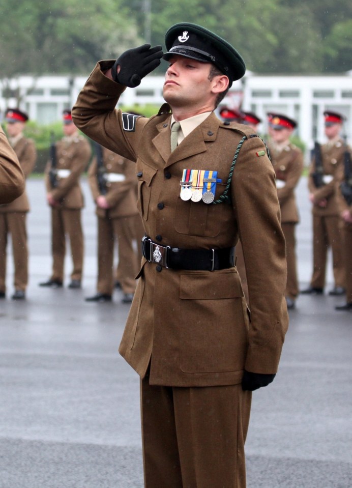 Cpl Hoole salutes at the 'RIFLES 7' passing out parade on June 10, 2016