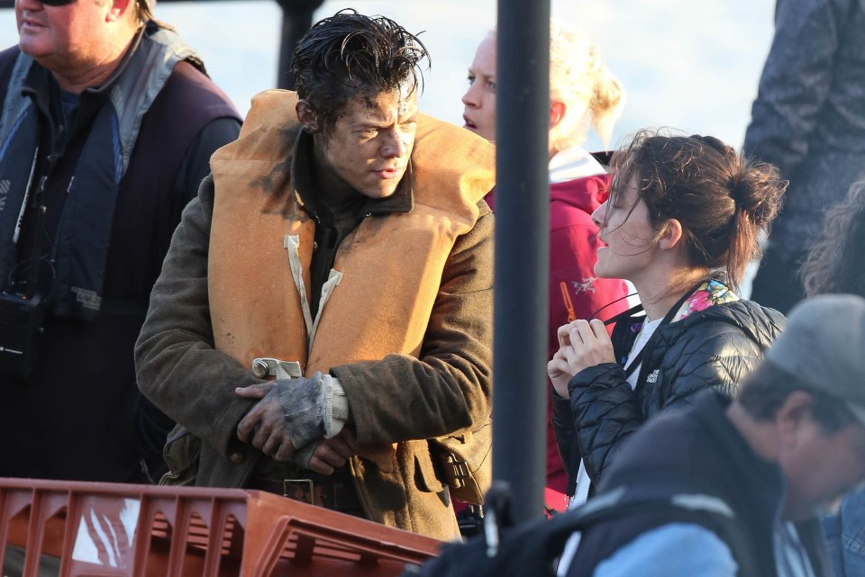  Harry was chatting to the assistant director before shooting his last scenes in Weymouth