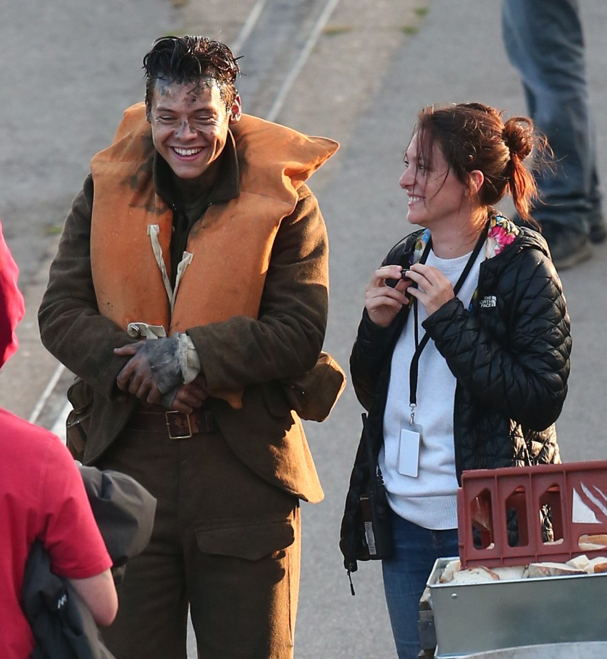  Harry was snapped flirting with a crew member