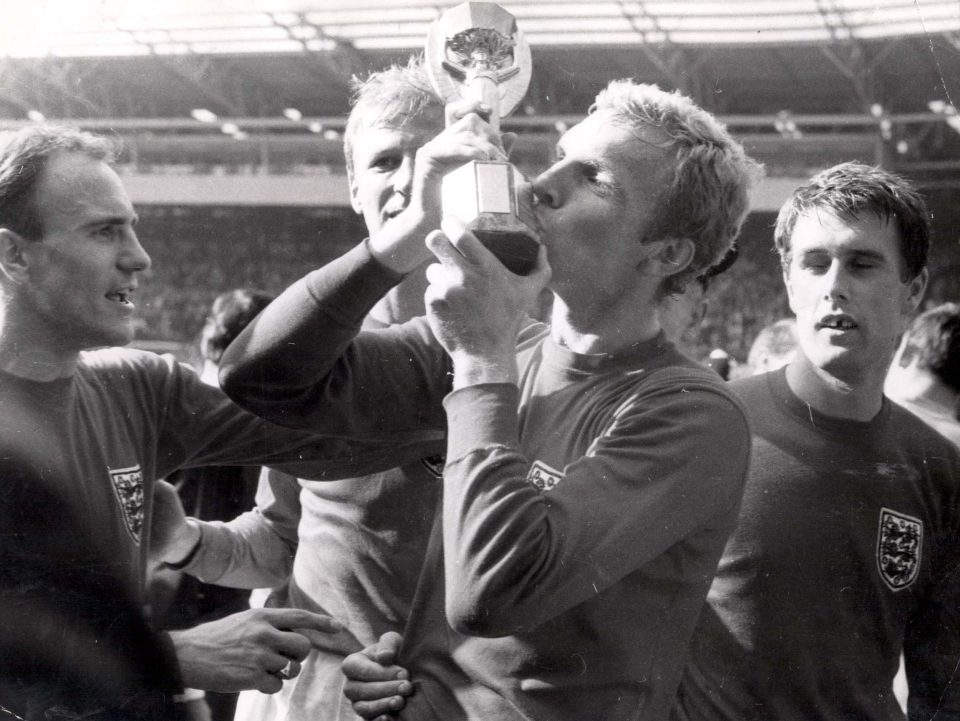 1966 skipper Geoff Hurst kisses the Jules Rimet trophy after victory over West Germany