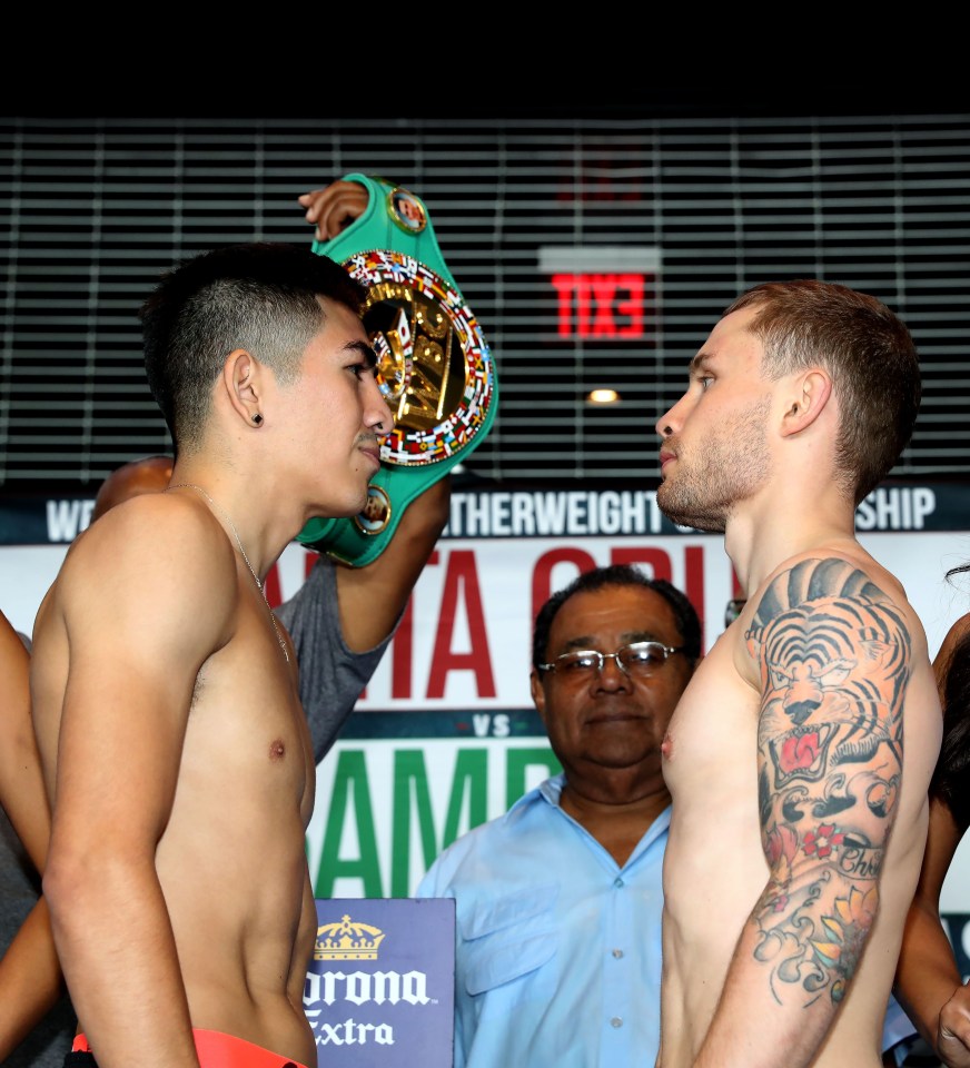  Leo Santa Cruz holds aloft his WBA Super featherweight belt at today's weigh-in