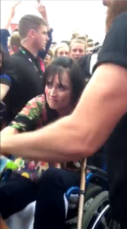  The tearful mum looks resigned as she is taken back through the crowd