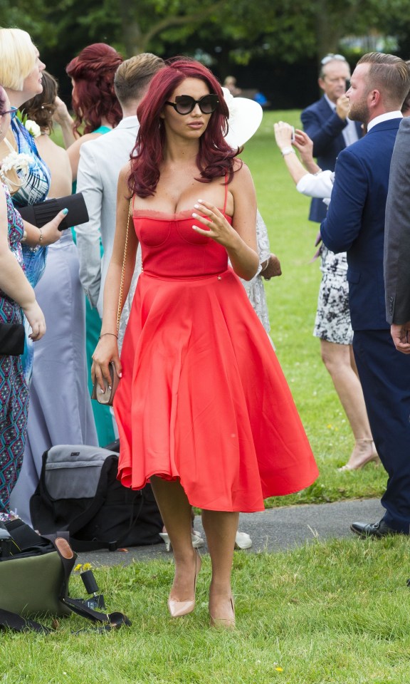  Amy stunned in red at an Essex wedding