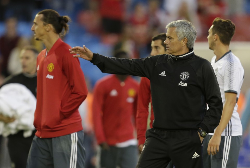  Jose Mourinho gives Zlatan Ibrahimovic a pat on the back after victory