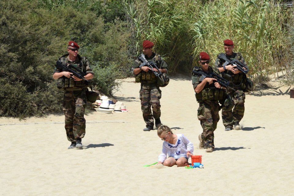  Soldiers patrol a beach on the French Riviera