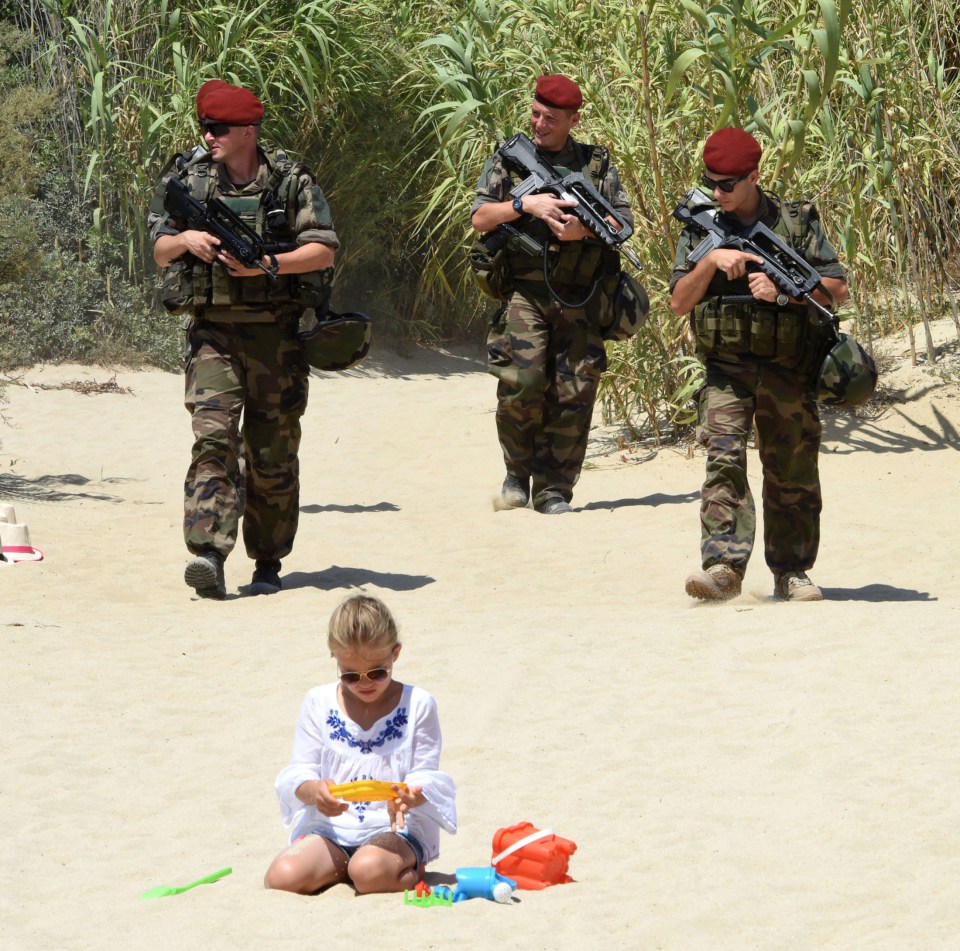 Armed military personnel are carrying out patrols on St Tropez beaches