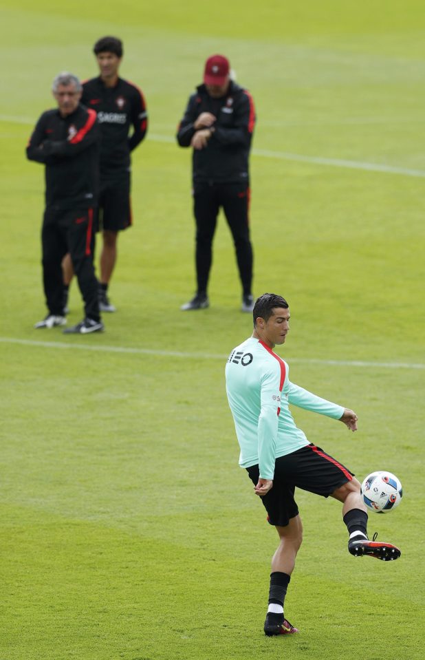  Coach Fernando Santos watches Cristiano Ronaldo during training on Monday