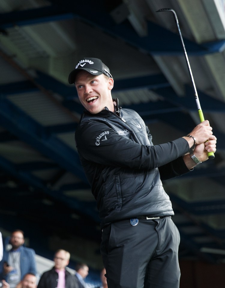  Danny Willett laughs as he hits a shot on the Callaway promotional stint at Ibrox