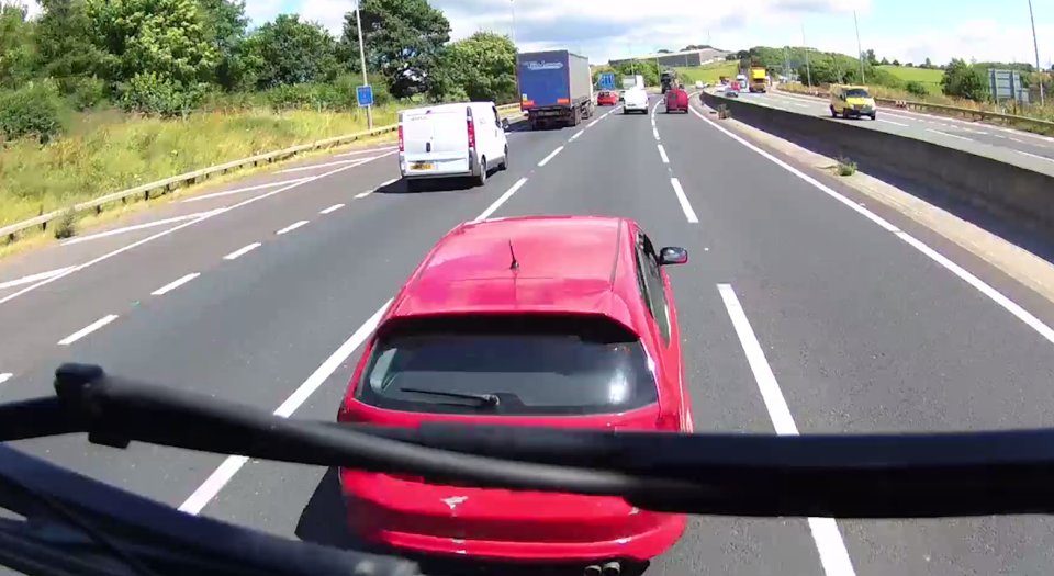  This part of the video shows the red car pulling in front of the lorry before braking sharply