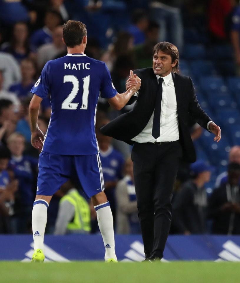  Chelsea manager Antonio Conte celebrates with Nemanja Matic after the final whistle