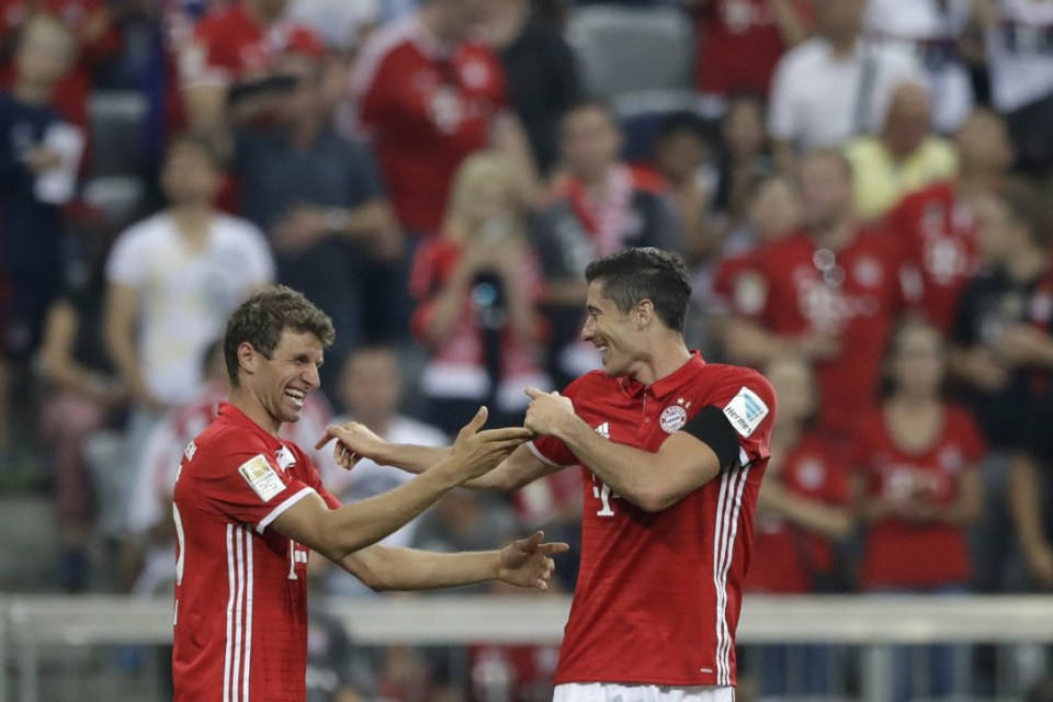  Robert Lewandowski celebrates with Thomas Muller, who struggled in front of goal