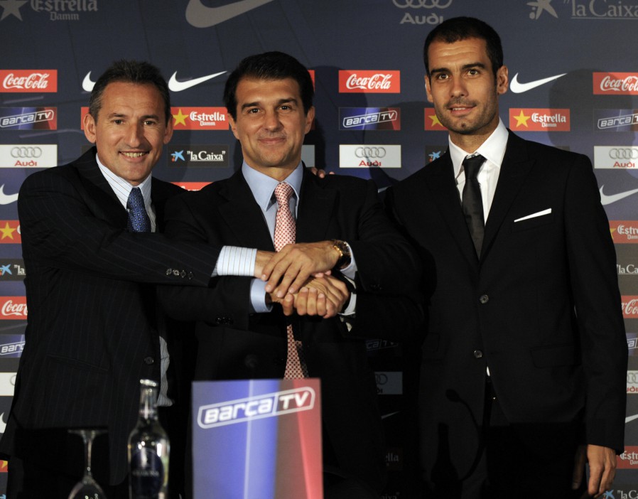 Barcelona president Joan Laporta (C) and director of football Txiki Begiristain (L) pose with Pep Guardiola (R) during his presentation as Barcelona's new coach on June 17, 2008 at the Camp Nou in Barcelona. The 37-year-old Guardiola is a former Barca captain making over 250 appearances for the club between 1990 and 2001, and winning six league titles and the 1992 Champions League in the process. AFP PHOTO/LLUIS GENE (Photo credit should read LLUIS GENE/AFP/Getty Images)