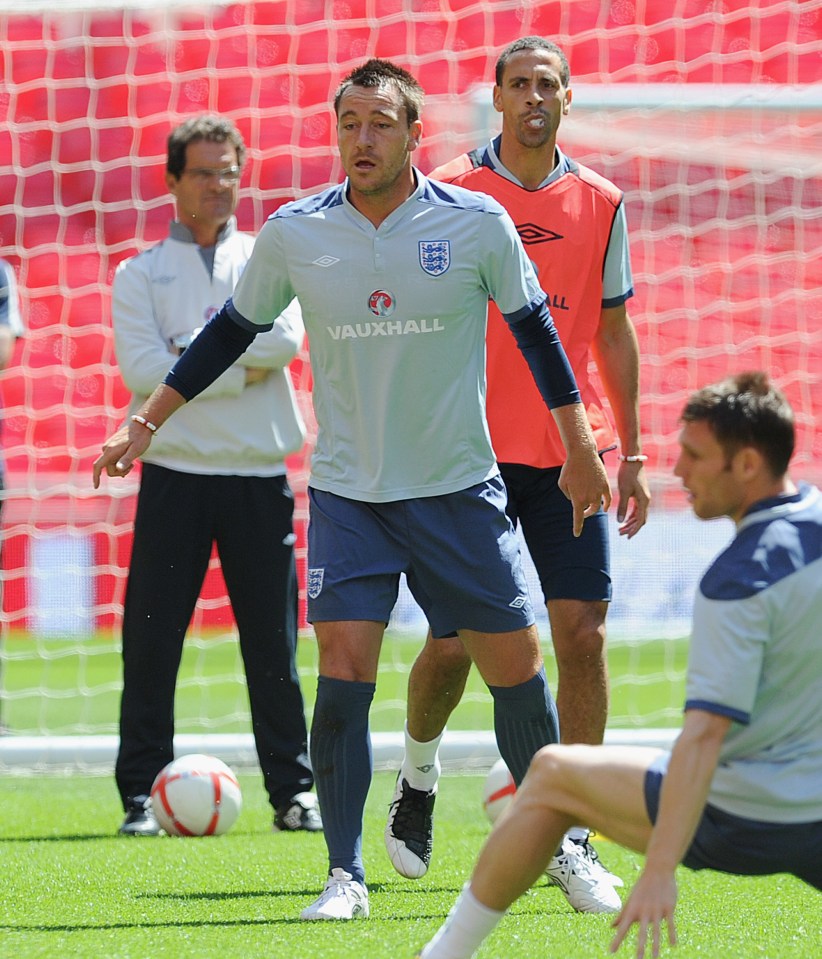 LONDON, ENGLAND - JUNE 03: England manager Fabio Capello looks on with Rio Ferdinand and John Terry during the England training session ahead of their Euro 2012 qualifier against Switzerland at Wembley Stadium on June 3, 2011 in London, England. (Photo by Michael Regan/Getty Images)