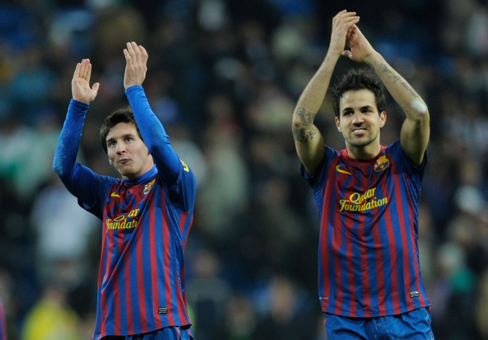  Lionel Messi and Cesc Fabregas celebrate after Barcelona's 3-1 win at Bernabeu