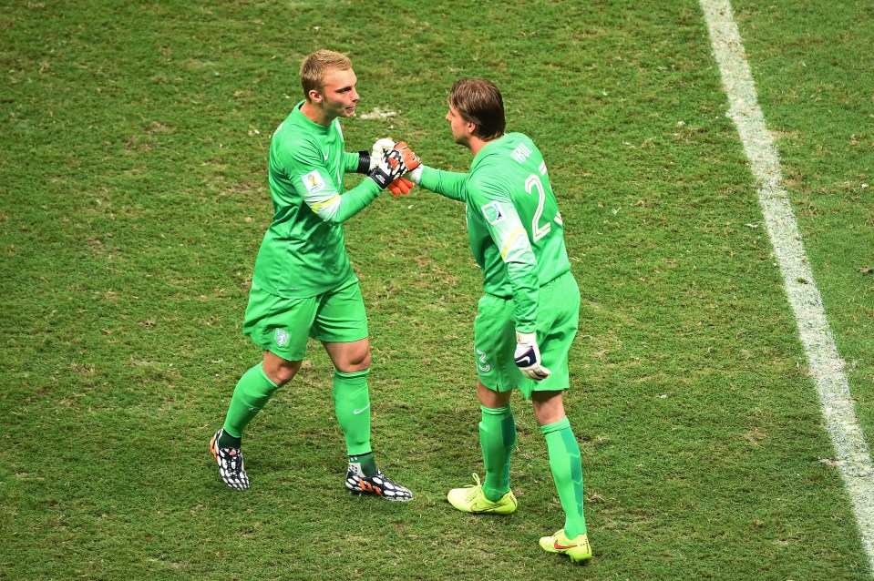 SALVADOR, BRAZIL - JULY 05: Tim Krul of the Netherlands shakes hands with Jasper Cillessen as he enters the game during the 2014 FIFA World Cup Brazil Quarter Final match between the Netherlands and Costa Rica at Arena Fonte Nova on July 5, 2014 in Salvador, Brazil. (Photo by Laurence Griffiths/Getty Images)