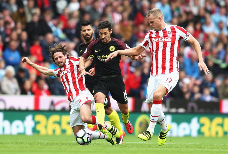  Ryan Shawcross tries to hold off Joe Allen during fiery clash with Manchester City