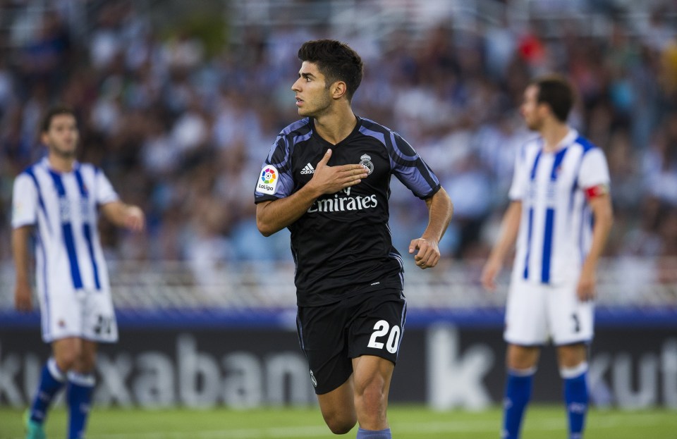 SAN SEBASTIAN, SPAIN - AUGUST 21: Marco Asensio of Real Madrid celebrates after scoring his team's second goal during the La Liga match between Real Sociedad de Futbol and Real Madrid at Estadio Anoeta on August 21, 2016 in San Sebastian, Spain. (Photo by Juan Manuel Serrano Arce/Getty Images)