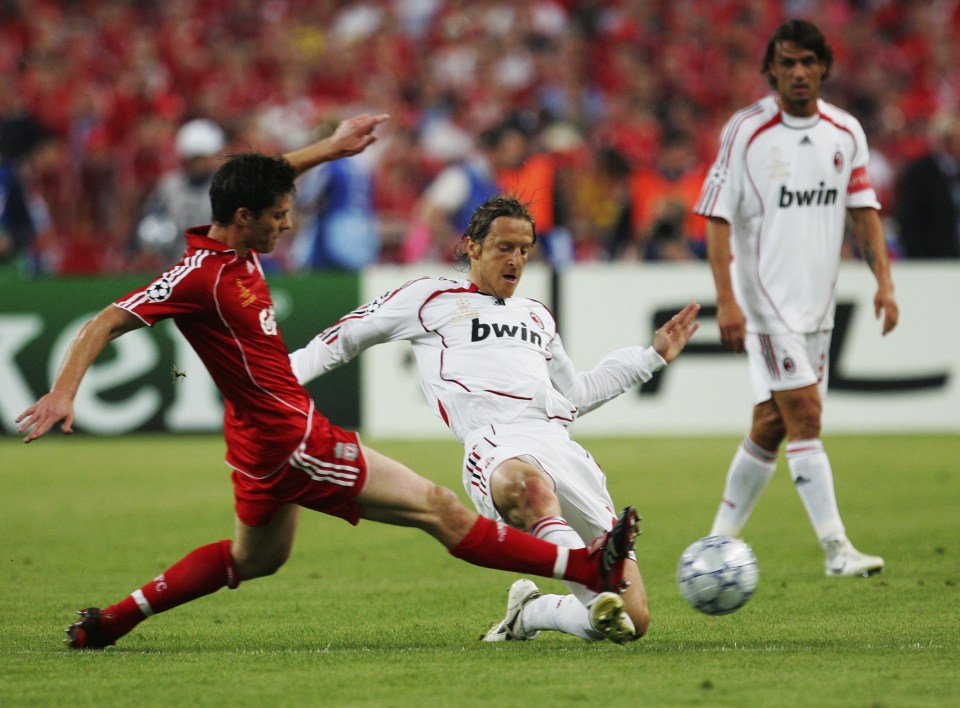 ATHENS, GREECE - MAY 23: Xabi Alonso (L) of Liverpool competes for the ball with Massimo Ambrosini of Milan during the UEFA Champions League Final match between Liverpool and AC Milan at the Olympic Stadium on May 23, 2007 in Athens, Greece. (Photo by Laurence Griffiths/Getty Images)