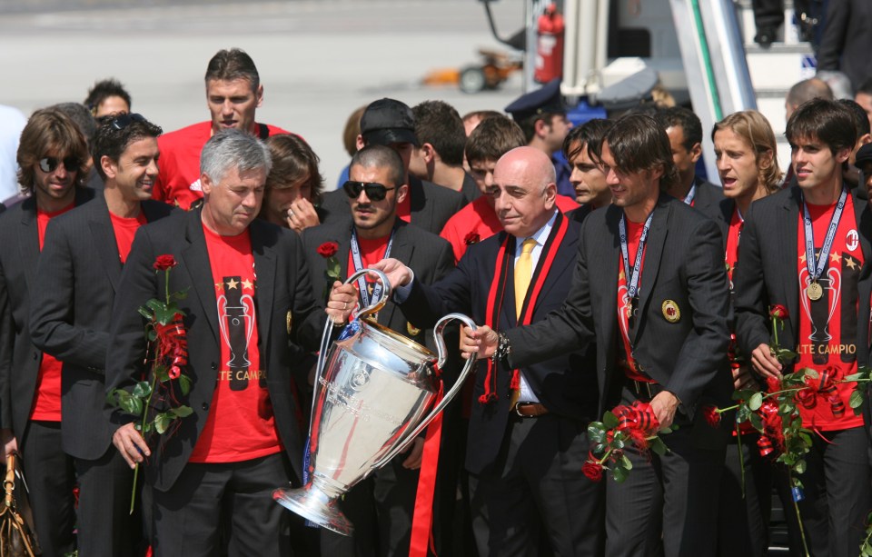 MILAN, ITALY - MAY 24: AC Milan coach Carlo Ancelotti (L) holds the Champion's League trophy with Paolo Maldini followed by Vice-President Adriano Galliani (C) during their arrival at the Malpensa Airport on May 24, 2007 in Milan, Italy. (Photo by Getty Images)