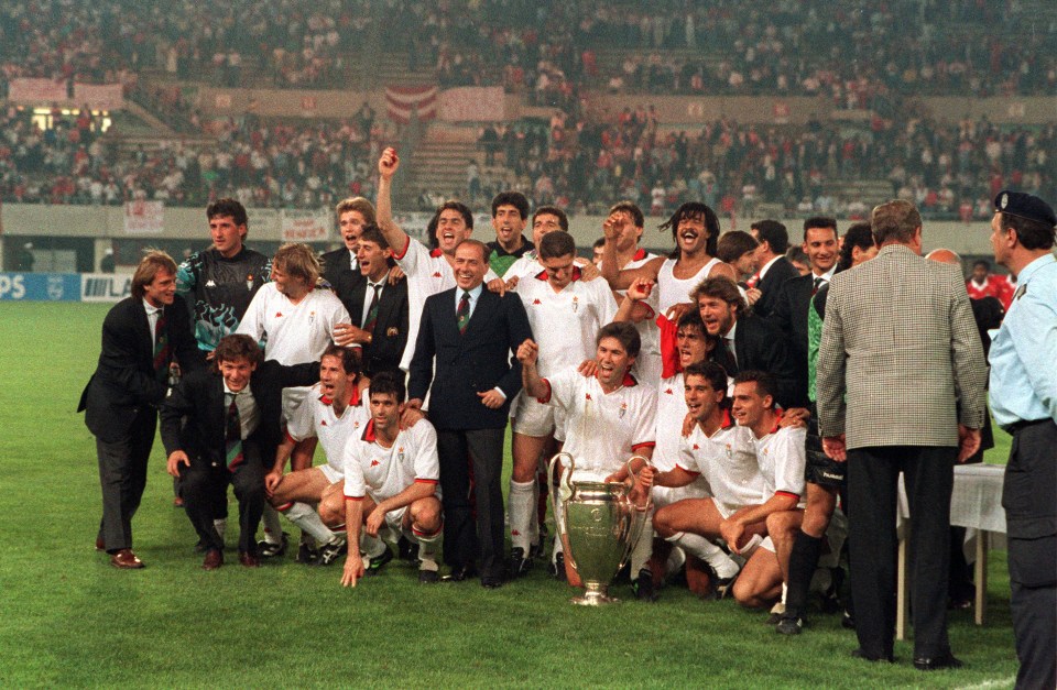  Silvio Berlusconi celebrates with the Milan players after European Cup glory in 1990