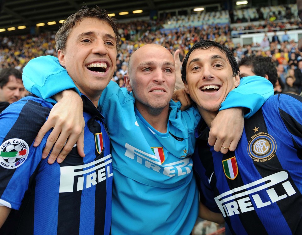 PARMA, ITALY - MAY 18: Hernan Crespo, Esteban Cambiasso and Nicolas Burdisso of Inter celebrate winning the Serie A title after the Serie A match between Parma and Inter at the Stadio Tardini on May 18, 2008 in Parma, Italy. (Photo by New Press/Getty Images)