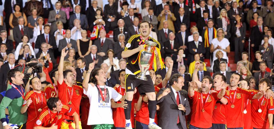 Spanish goalkeeper and captain Iker Casillas (C), flanked by teammates, celebrates with the trophy after the Euro 2008 championships final football match Germany vs. Spain on June 29, 2008 at Ernst-Happel stadium in Vienna, Austria. Spain won their first trophy in 44 years here on Sunday as they beat three-time champions Germany 1-0 in the Euro 2008 final.AFP PHOTO / FRANCK FIFE -- MOBILE SERVICES OUT -- (Photo credit should read FRANCK FIFE/AFP/Getty Images)