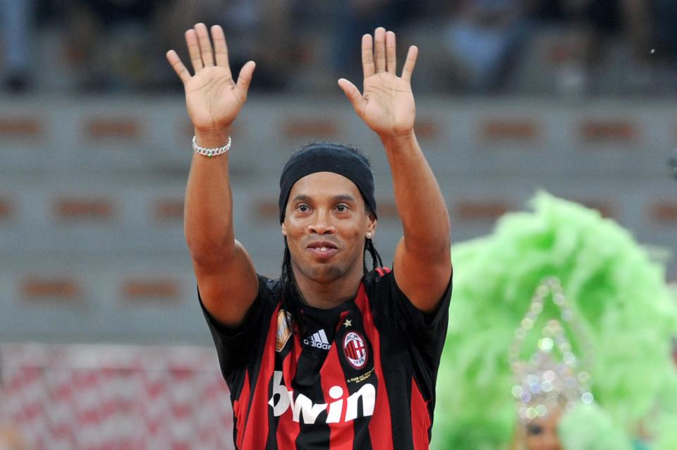 AC Milan's Brazilian forward Ronaldinho waves to supporters during his presentation to supporters at San Siro Stadium on July 17, 2008. Ronaldinho, who has completed a 18.5-million-euro move from Barcelona was presented to the Rossoneri fans. AFP PHOTO / GIUSEPPE CACACE CACACE (Photo credit should read GIUSEPPE CACACE/AFP/Getty Images)