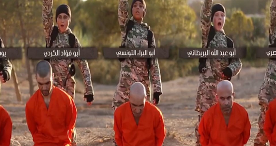  The boy and four others are shown executing ISIS captives in Raqqah