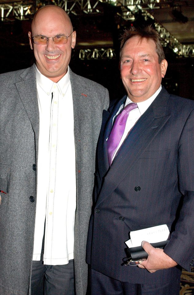  David, seen here with business partner Tim Clark, managed Robbie for 20 years