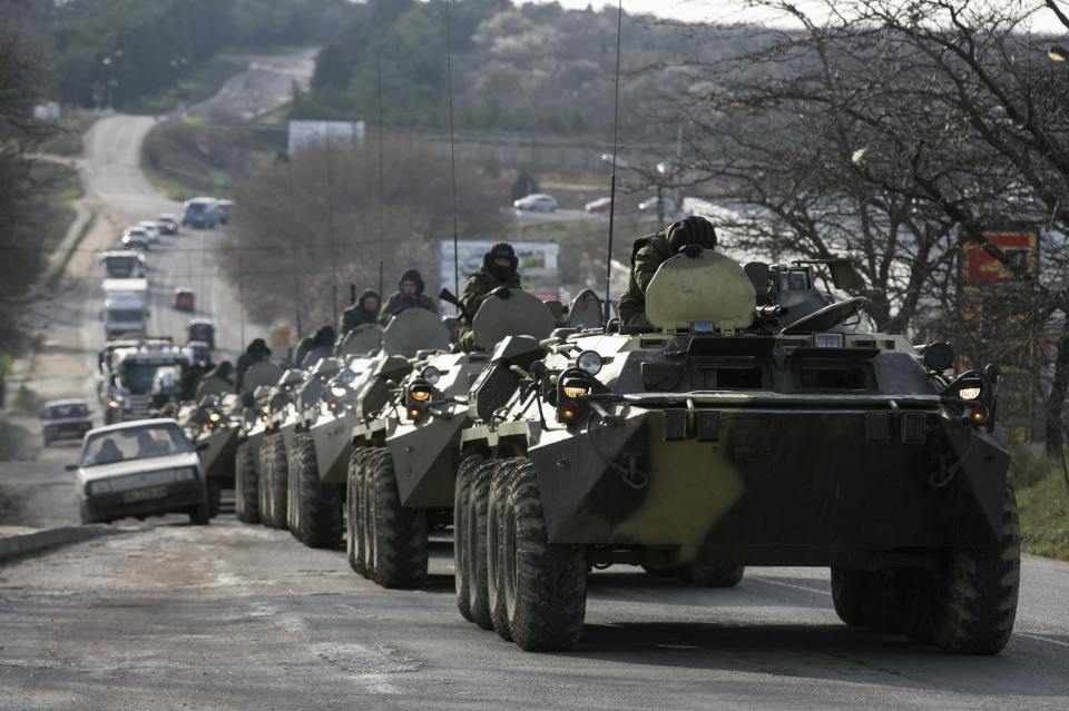  Russian armoured personnel carriers travel through the Crimea during its 2014 annexation from Ukraine