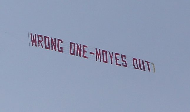  A plane flying a banner reading 'wrong one - Moyes out' flies over Old Trafford during the former Everton manager's Manchester United reign