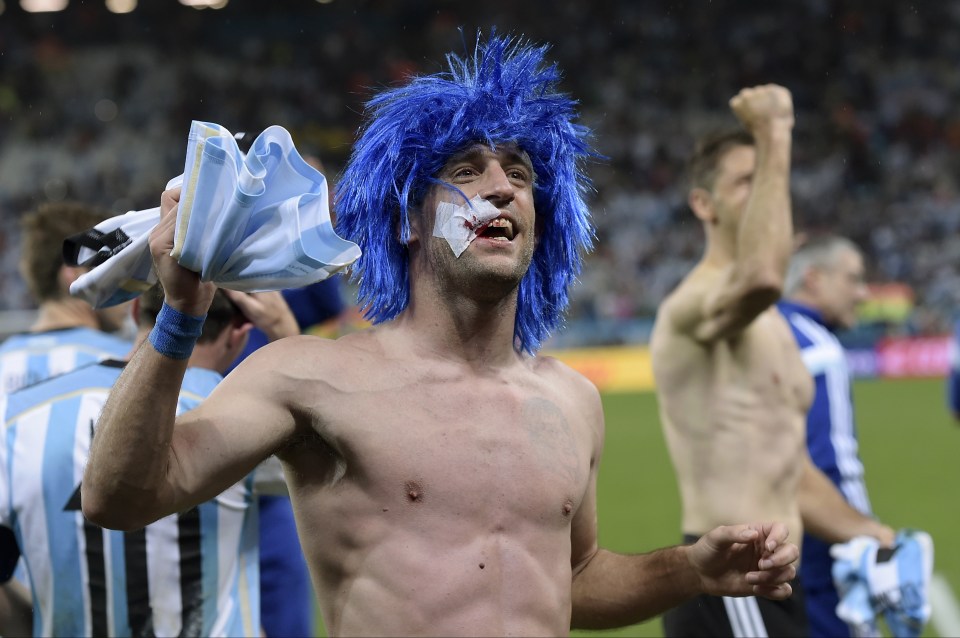  Zabaleta celebrates after winning a penalty shoot-out at the end of the World Cup semi-final between the Netherlands and Argentina in Sao Paulo