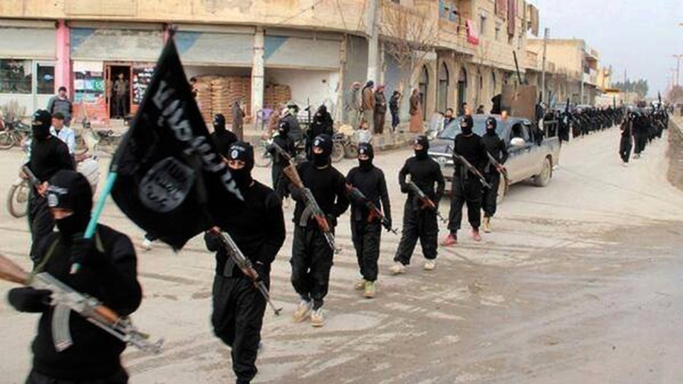  ISIS fighters marching through the streets of Raqqa, Syria