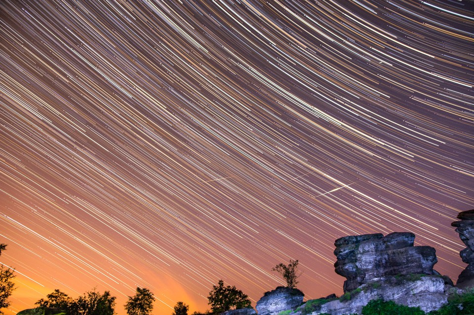  A time lapse photograph captures shooting stars streaking across the night sky over the Yorkshire dales