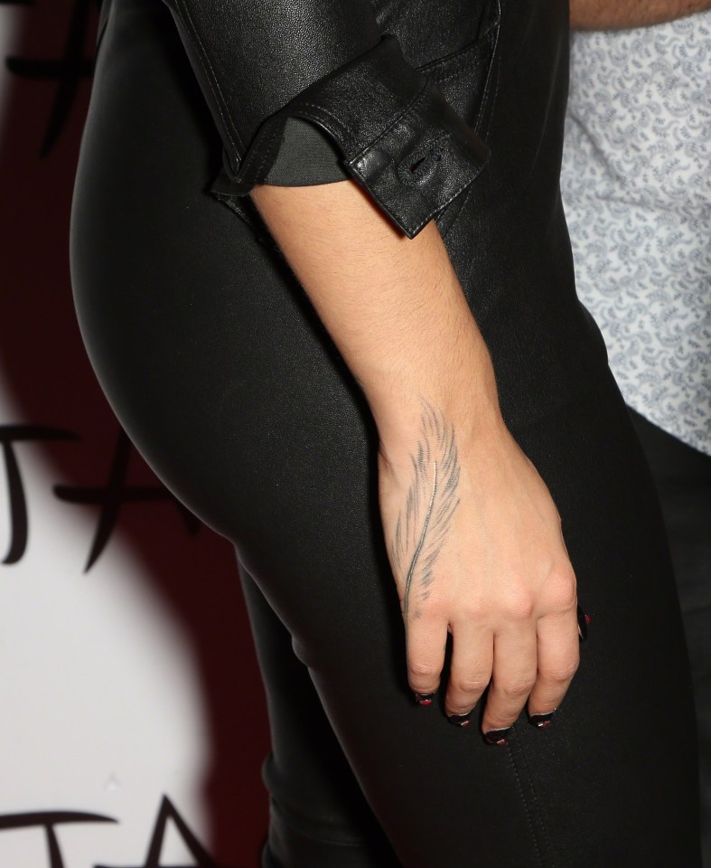  The rose covered up a feather she had inked in 2014