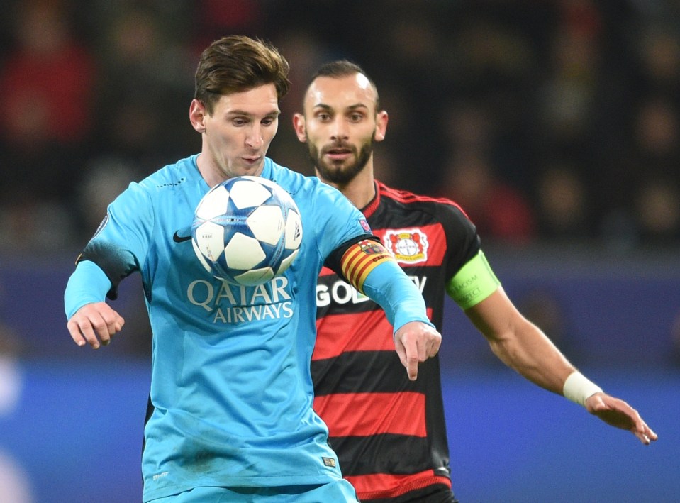  Omer Toprak attempts to challenge Lionel Messi in the Champions League