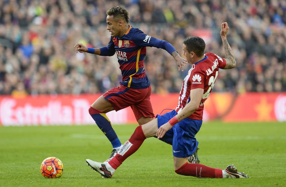  Jose Gimenez tackles Barcelona's Neymar