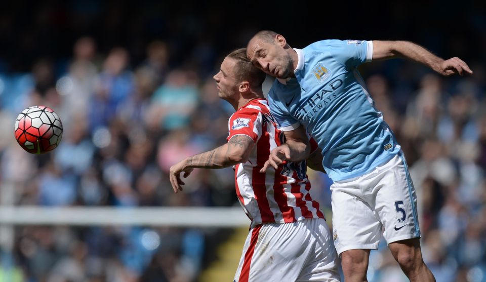  Zabaleta vies with Stoke City's Austrian striker Marko Arnautovic during the Premier League match between Manchester City and Stoke City at the Etihad