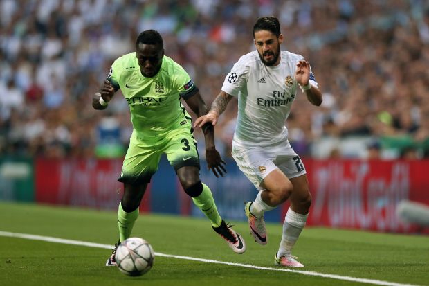 Manchester City's Bacary Sagna (left) and Real Madrid's Isco battle for the ball during the UEFA Champions League Semi Final, Second Leg match at the Santiago Bernabeu, Madrid. PRESS ASSOCIATION Photo. Picture date: Wednesday May 4, 2016. See PA story SOCCER Real Madrid. Photo credit should read: Adam Davy/PA Wire